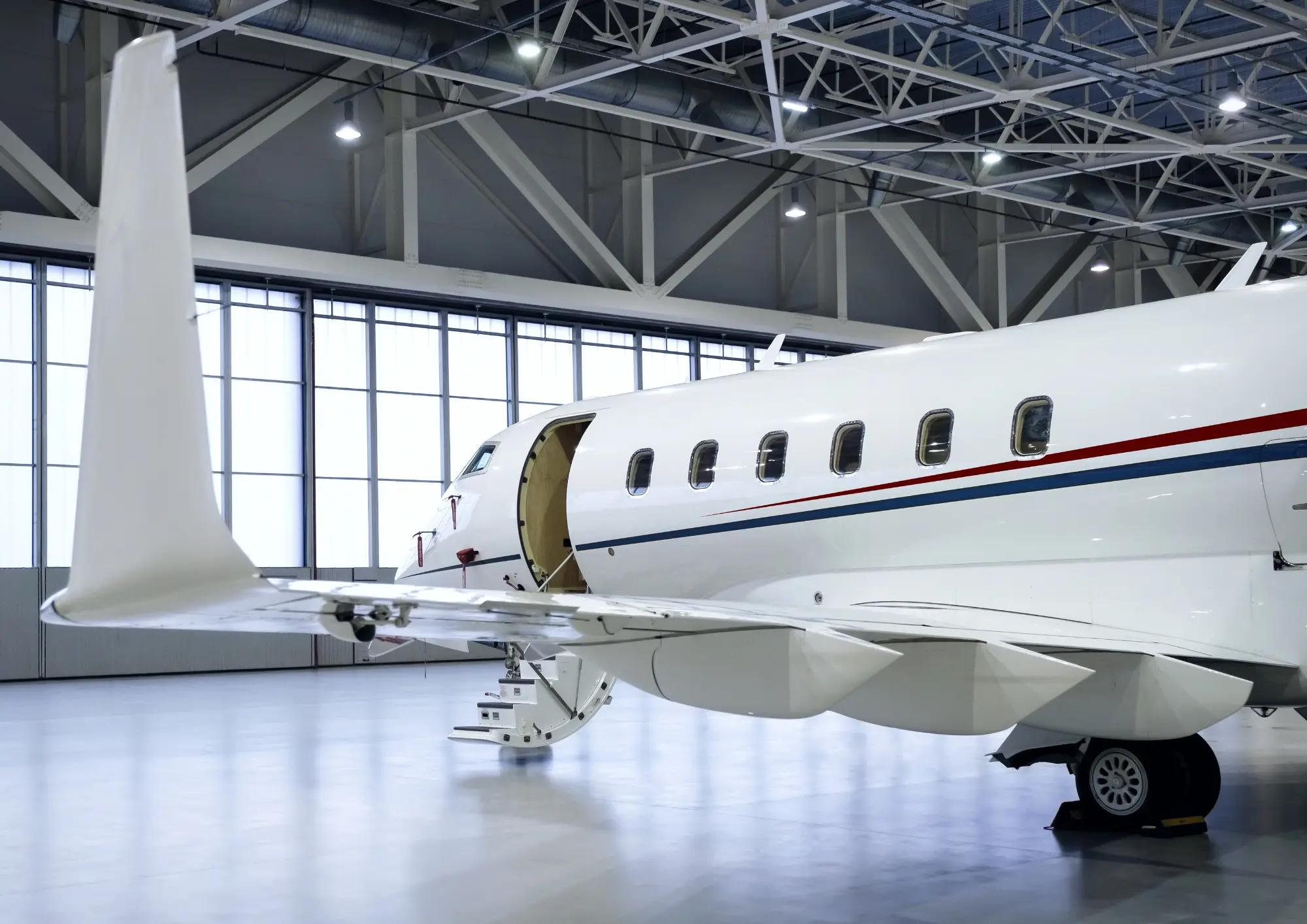 Parked jet inside a hangar.